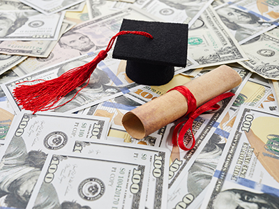 Cap and Diploma on top of money